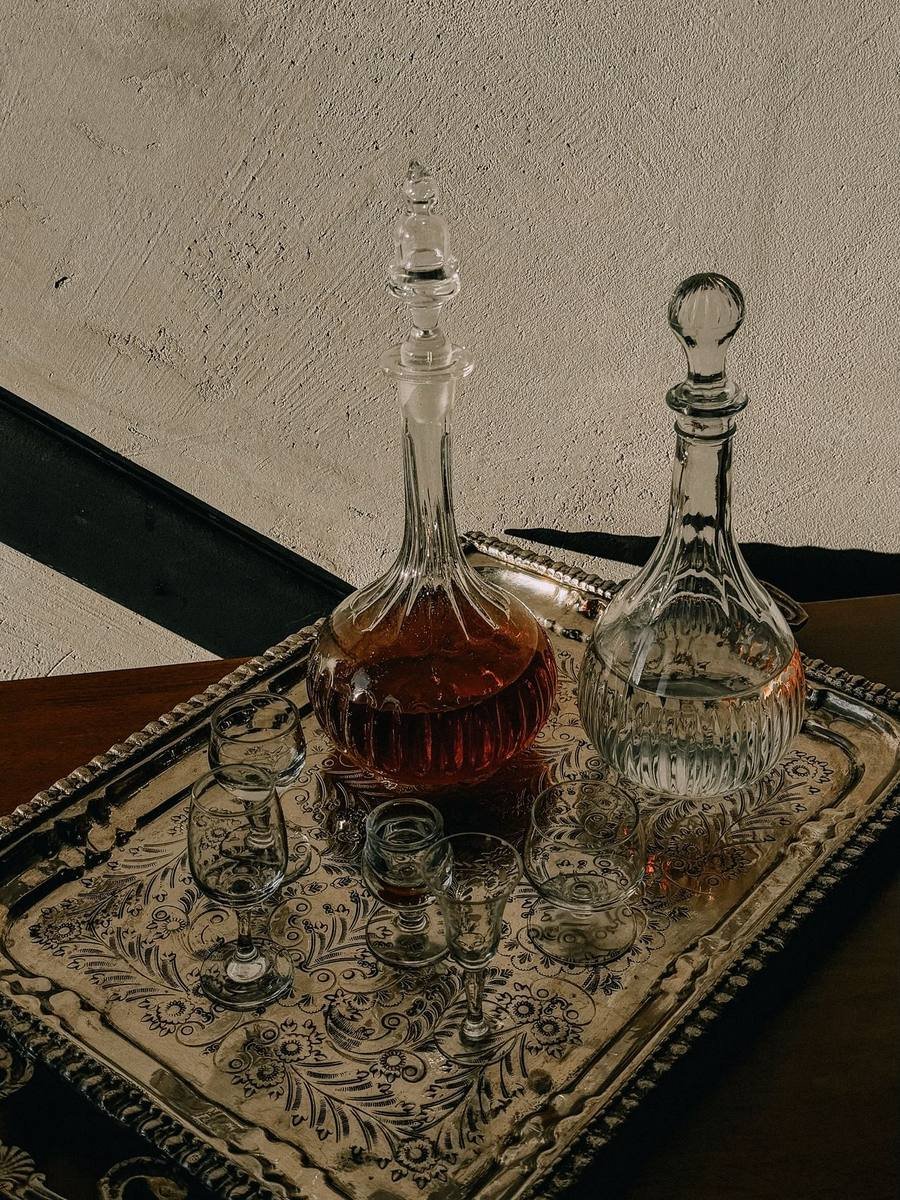 Vintage crystal decanters on an engraved metal tray